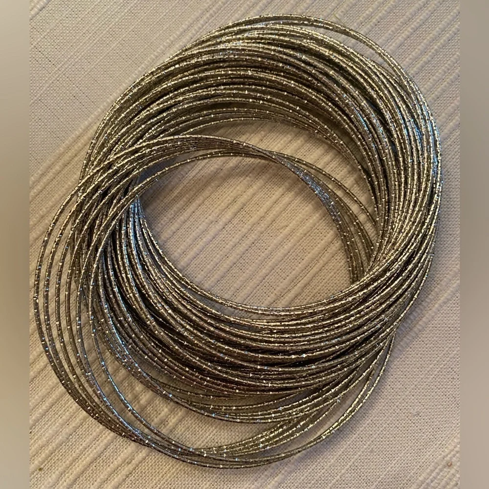 Set of Bangle Bracelets and Single Pink Chunky Bracelet
